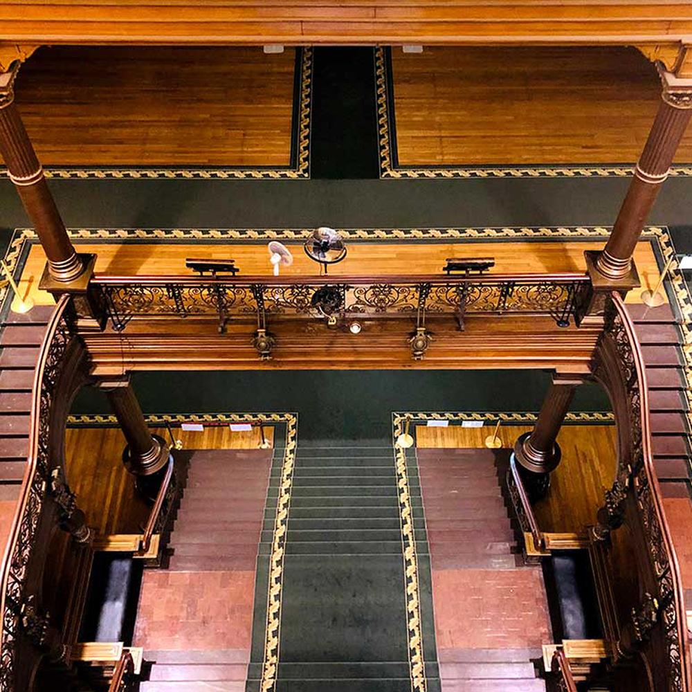 a bird's-eye view of the grand staircase showcasing the oak and slate used in construction of the staircase