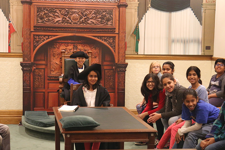 group of children in a mock legislative Chamber