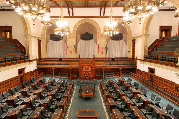 legislative Chamber with empty desks, clerks' table, and Speaker's chair