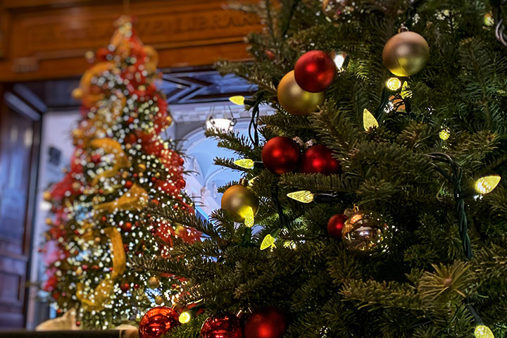 two Christmas trees on staircase inside the Legislative Building