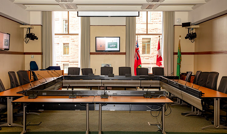 empty committee room with tables in a square