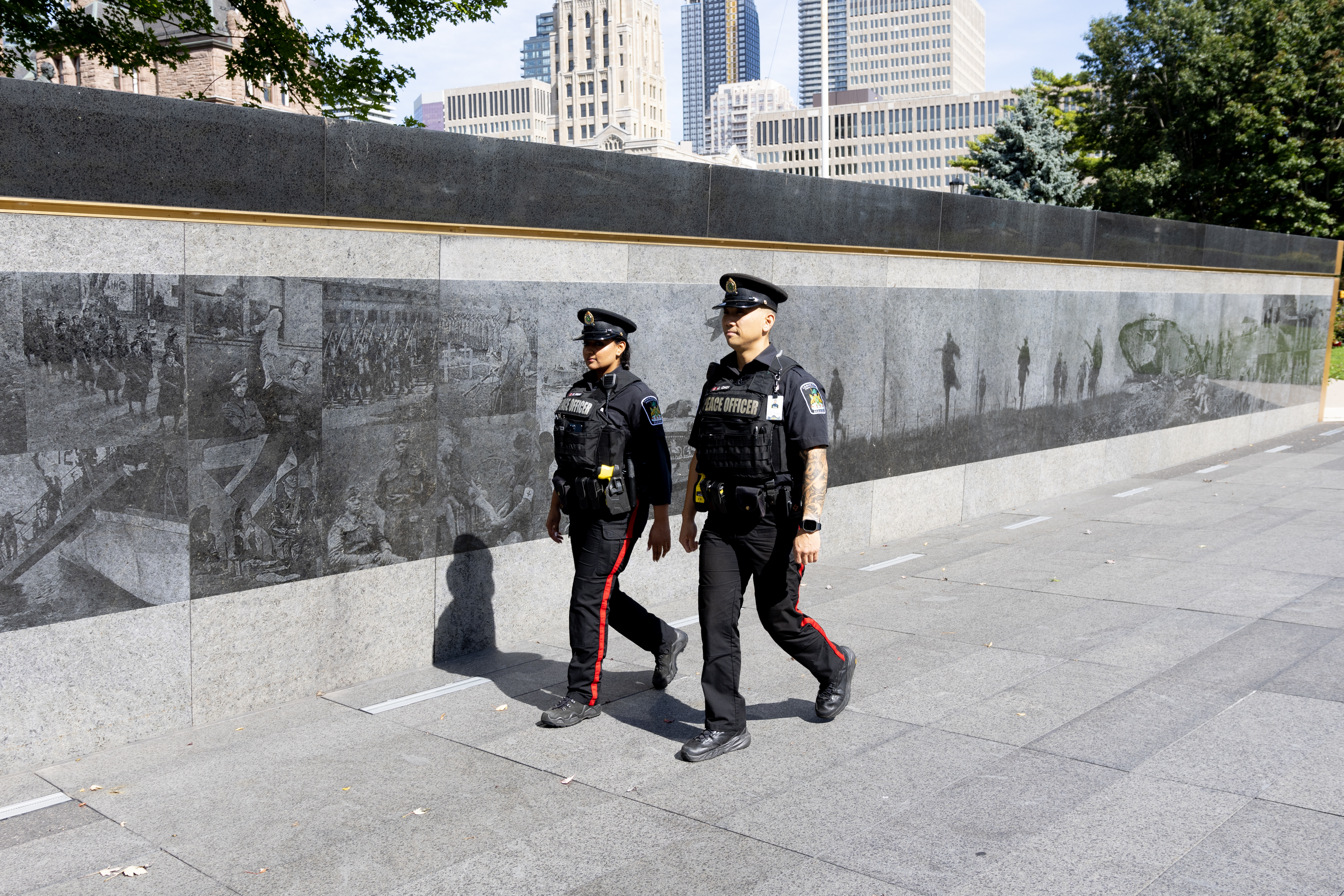 two LPS officers walking outside main building